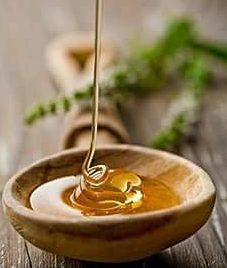 Cire orientale miel dans cuillère en bois